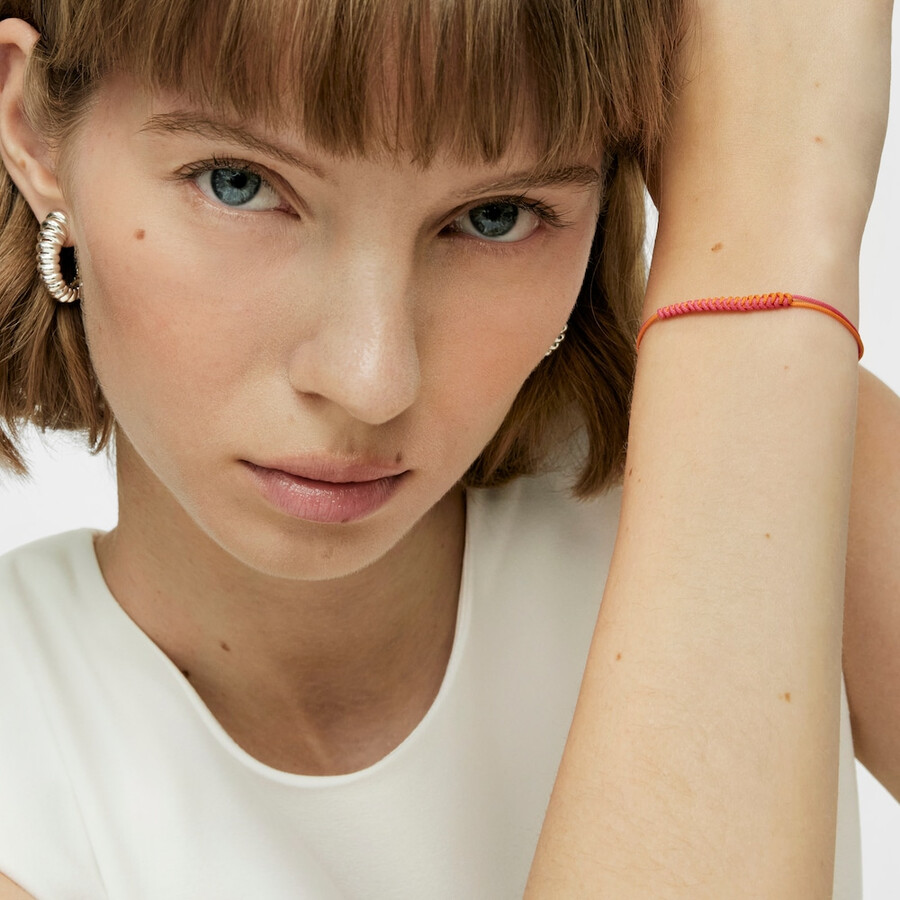 bracciale bold bear con cordino fucsia e arancione e un orso argentato
