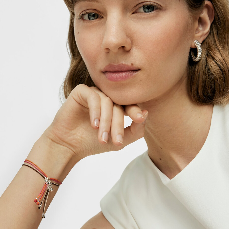 bracciale bold bear con cordino fucsia e arancione e un orso argentato