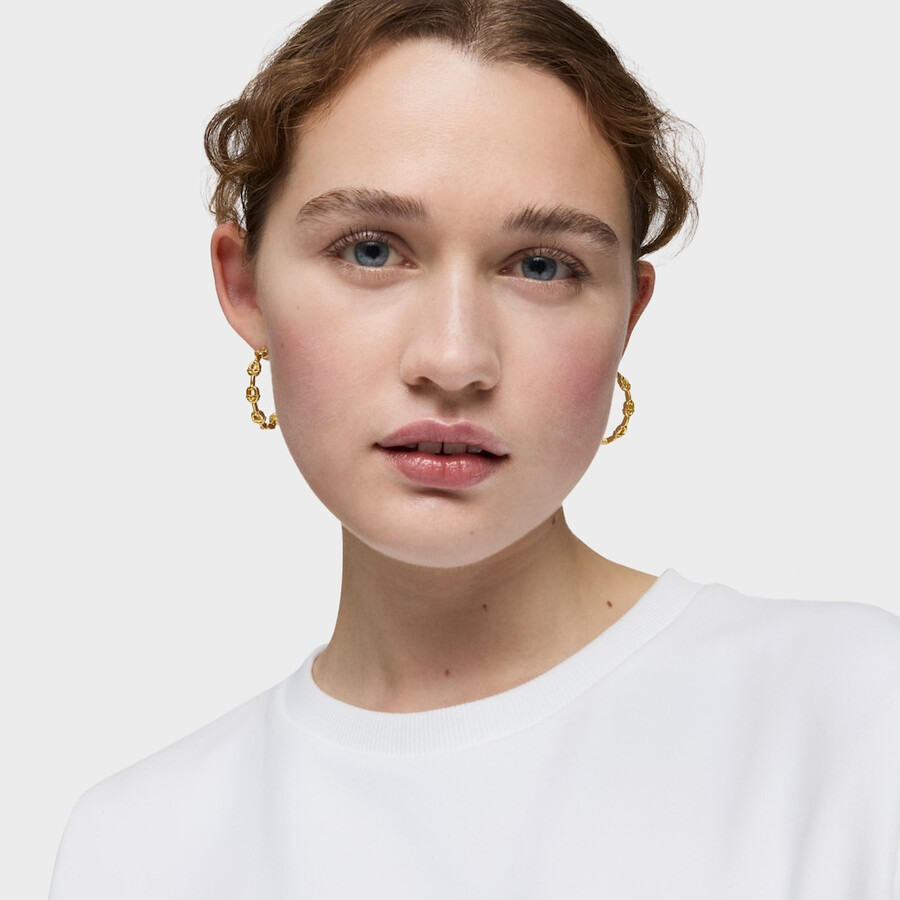 orecchini a cerchio da 30 mm placcati in oro 18kt con logo in argento tous manifesto